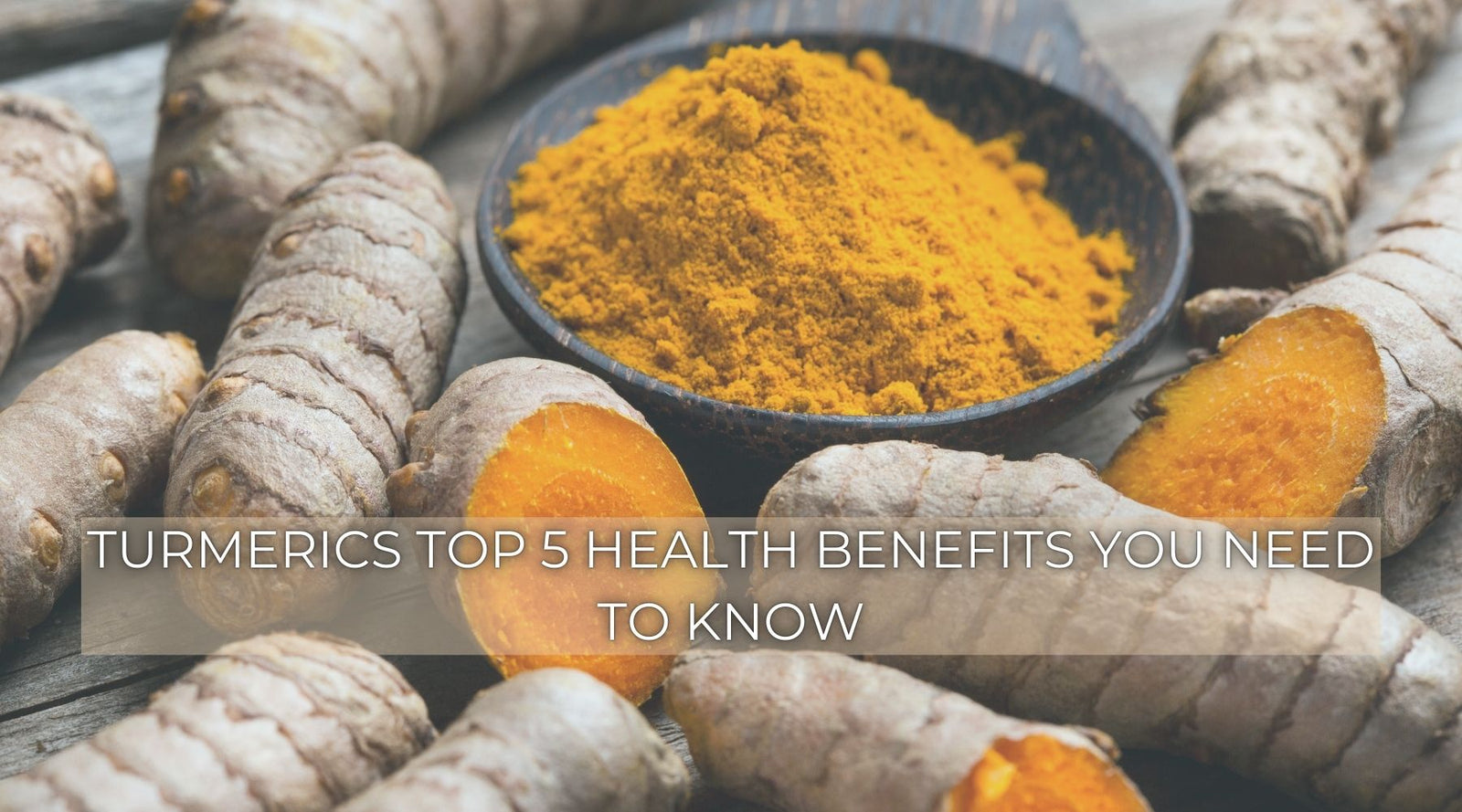 Fresh turmeric roots and powder with overlay text “Turmeric’s Top 5 Health Benefits You Need to Know.”